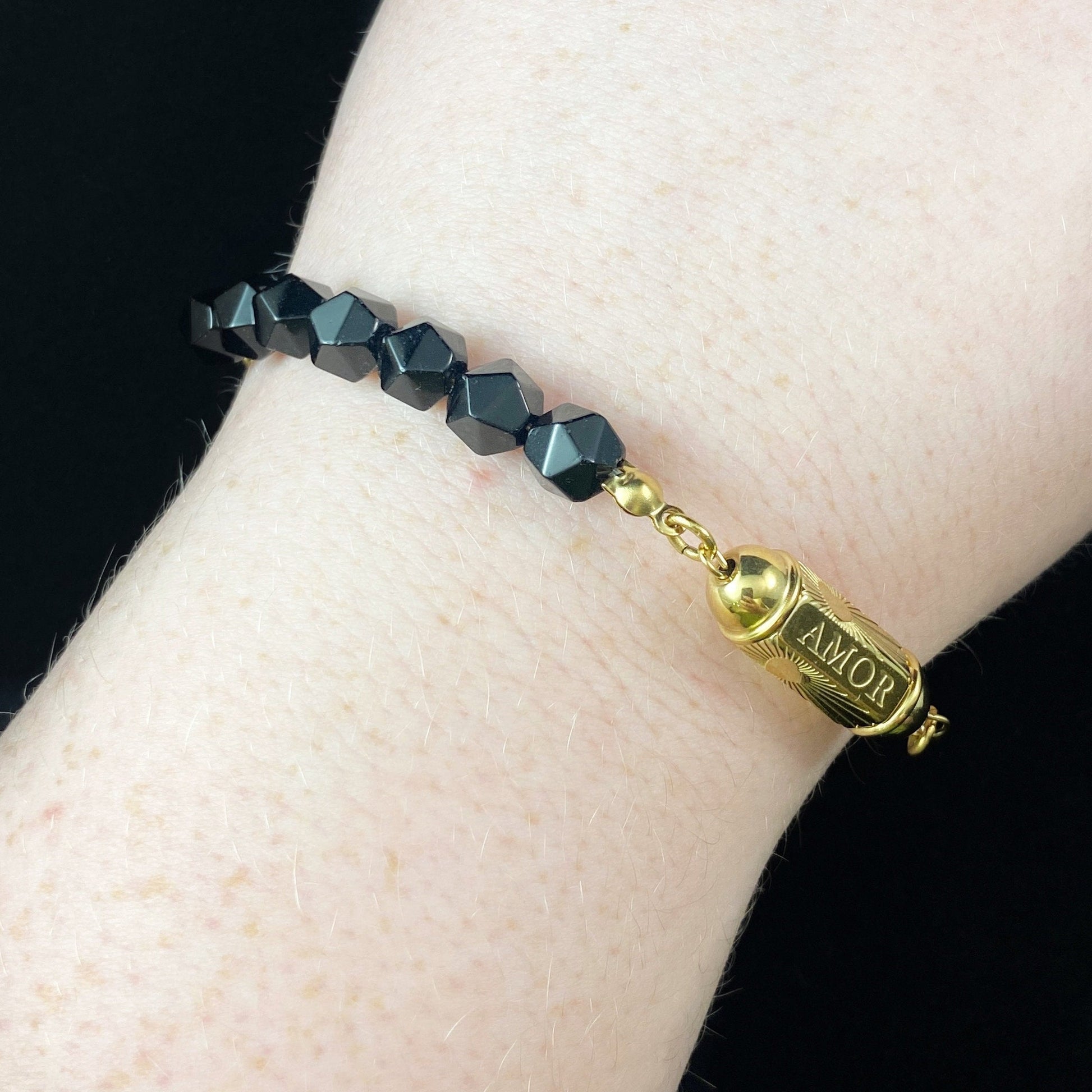 Black Natural Stone Bracelet with Love/Amor Calligraphy and Dainty Gold Heart Detailing
