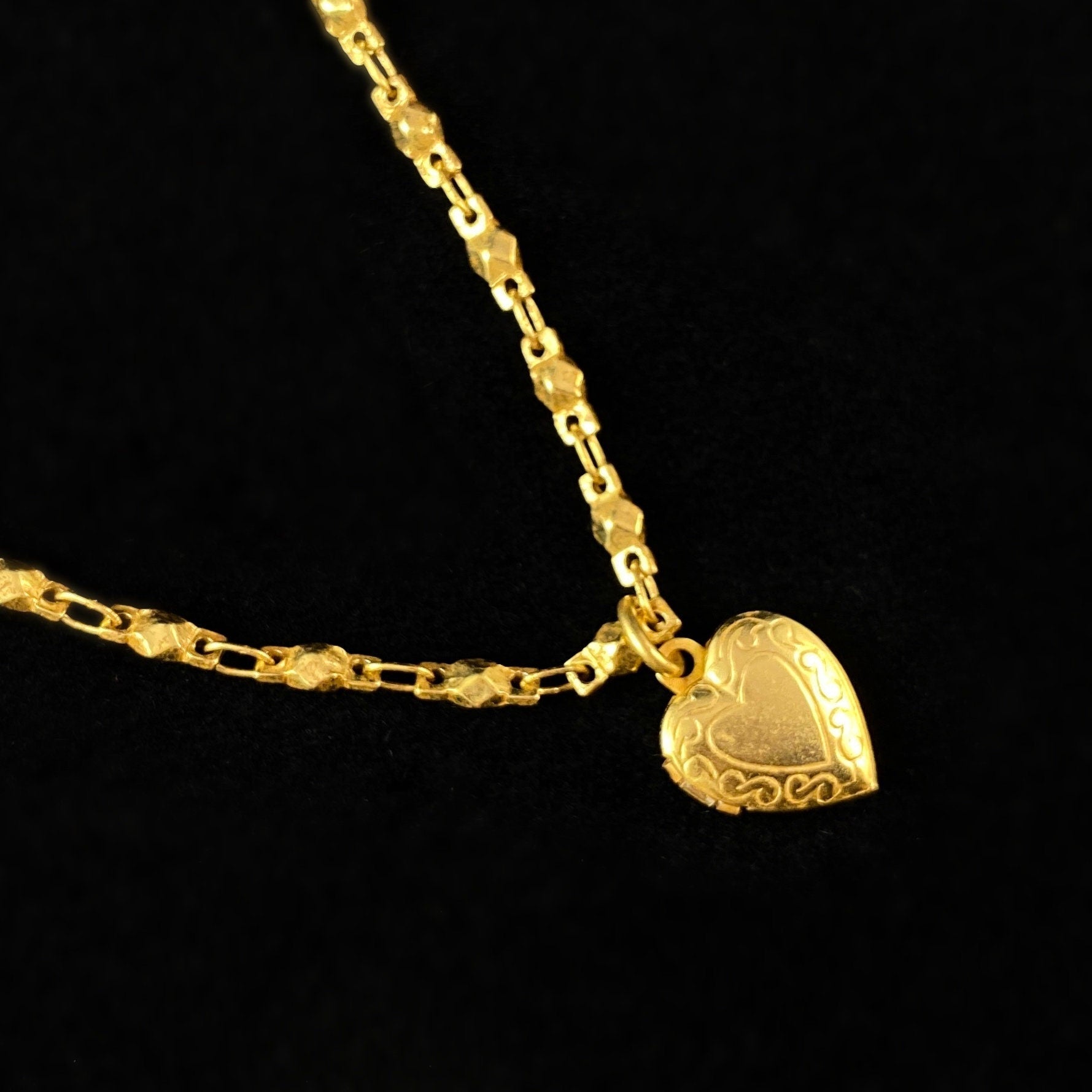 Tiny Gold Heart Locket with Intricate Detailing and a Geometric Chain - La Vie Parisienne by Catherine Popesco